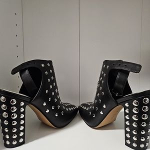1. State block heel boot with studs